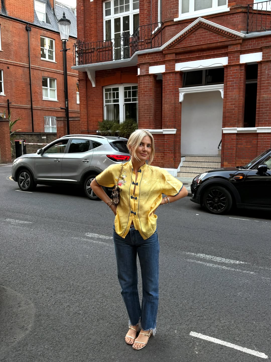 Lucy wearing metallic sandals