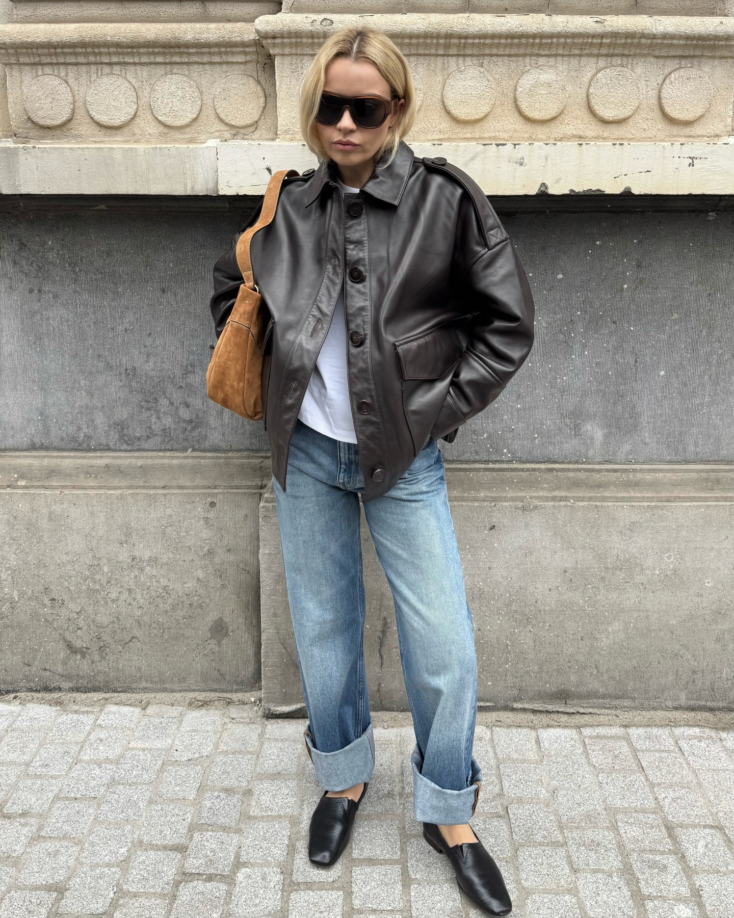 European influencer wearing jeans and soft loafers