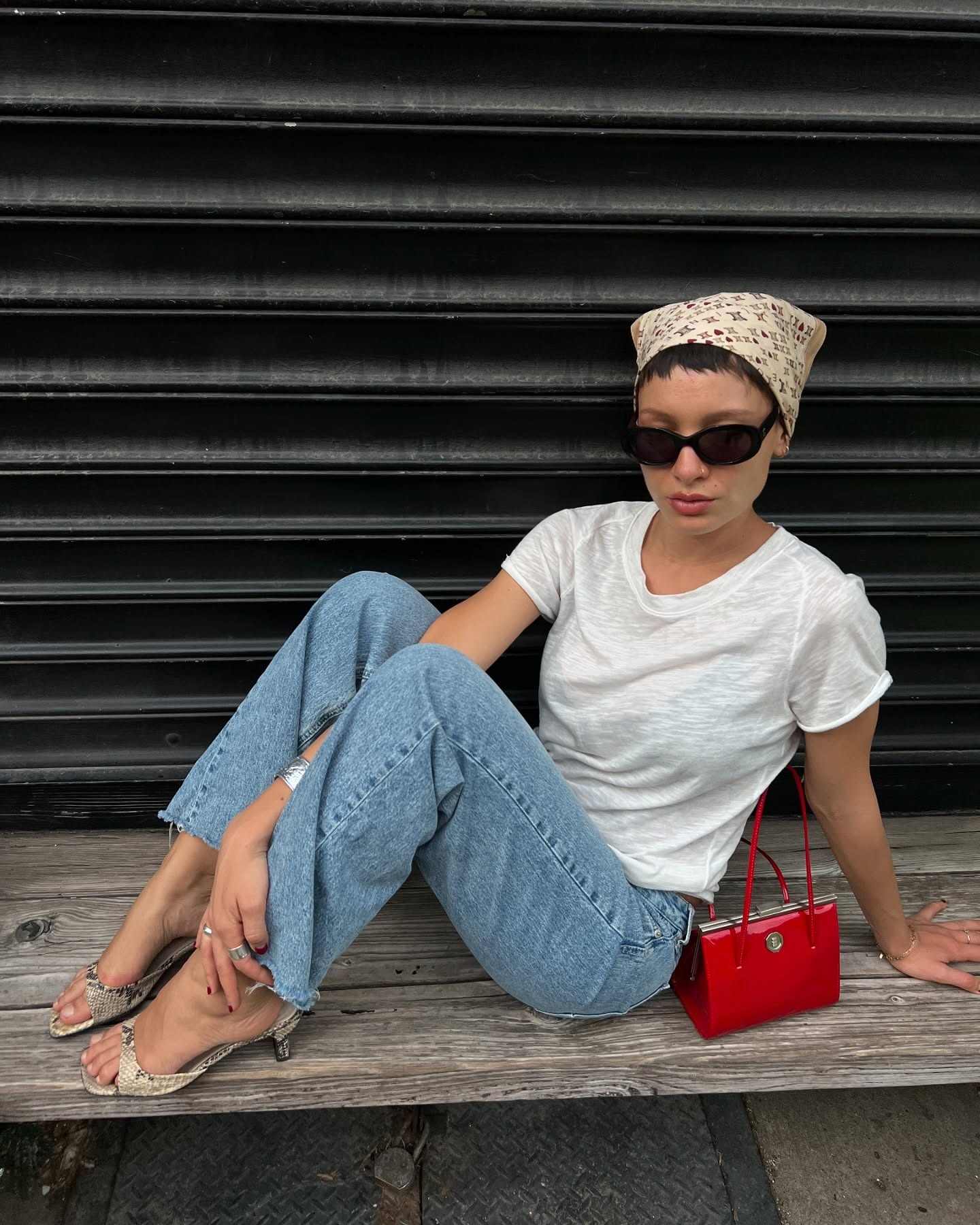 @aishafarida wearing a white T-shirt and jeans outfit with kitten heels