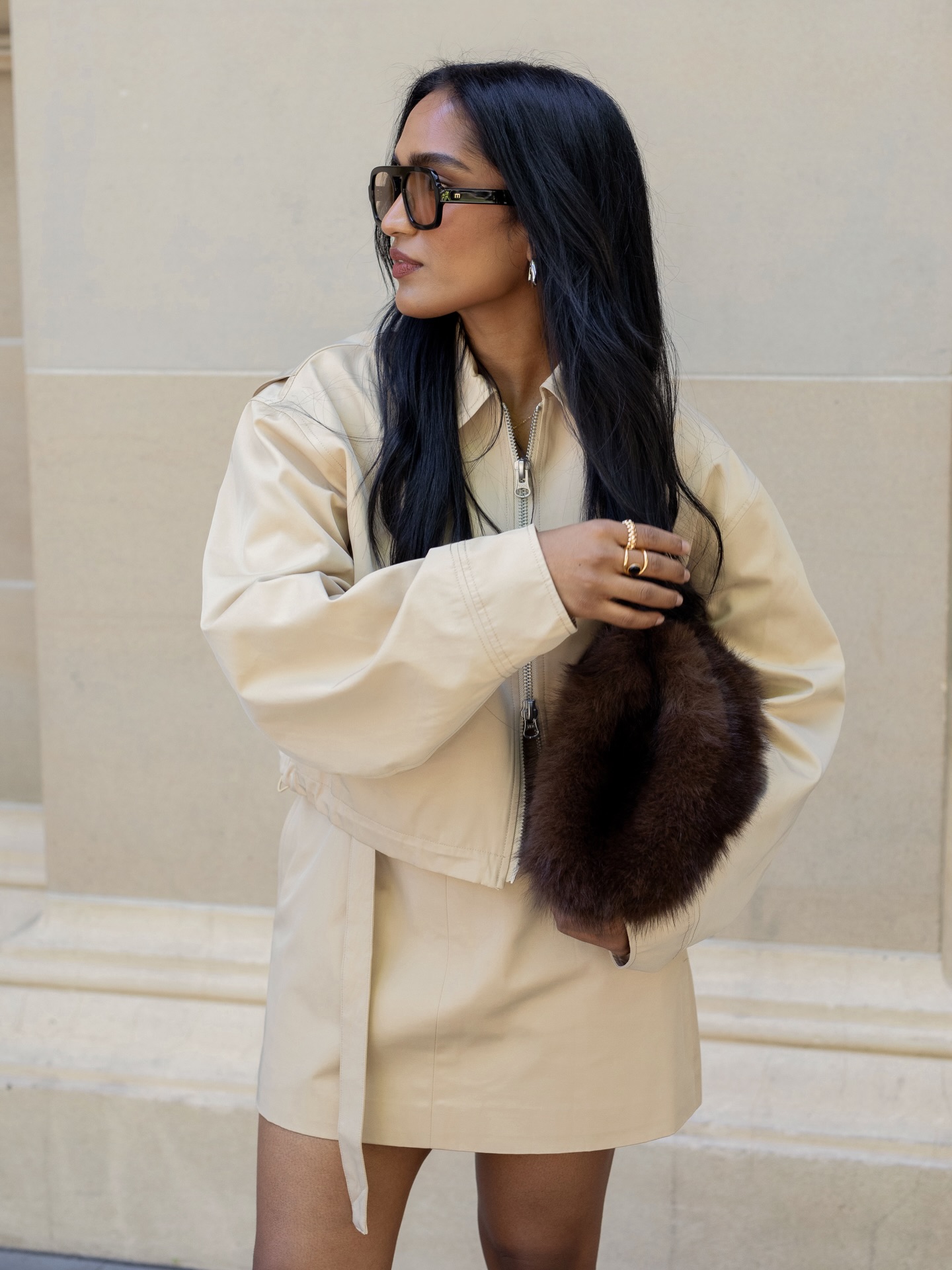 divrav wears a matching cream jacket and mini skirt co-ord