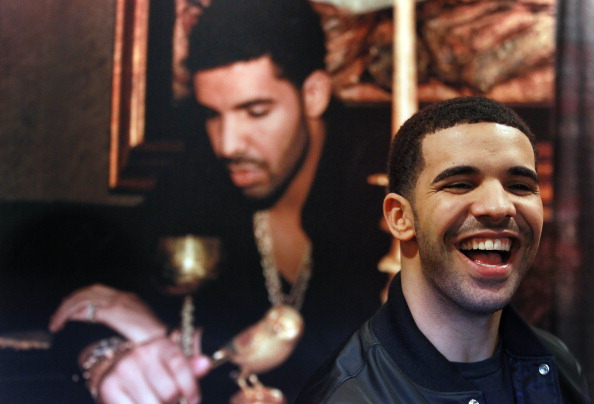 Drake signs autographs for the first 500 fans that ordered his new album "Take Care" at the Queen St