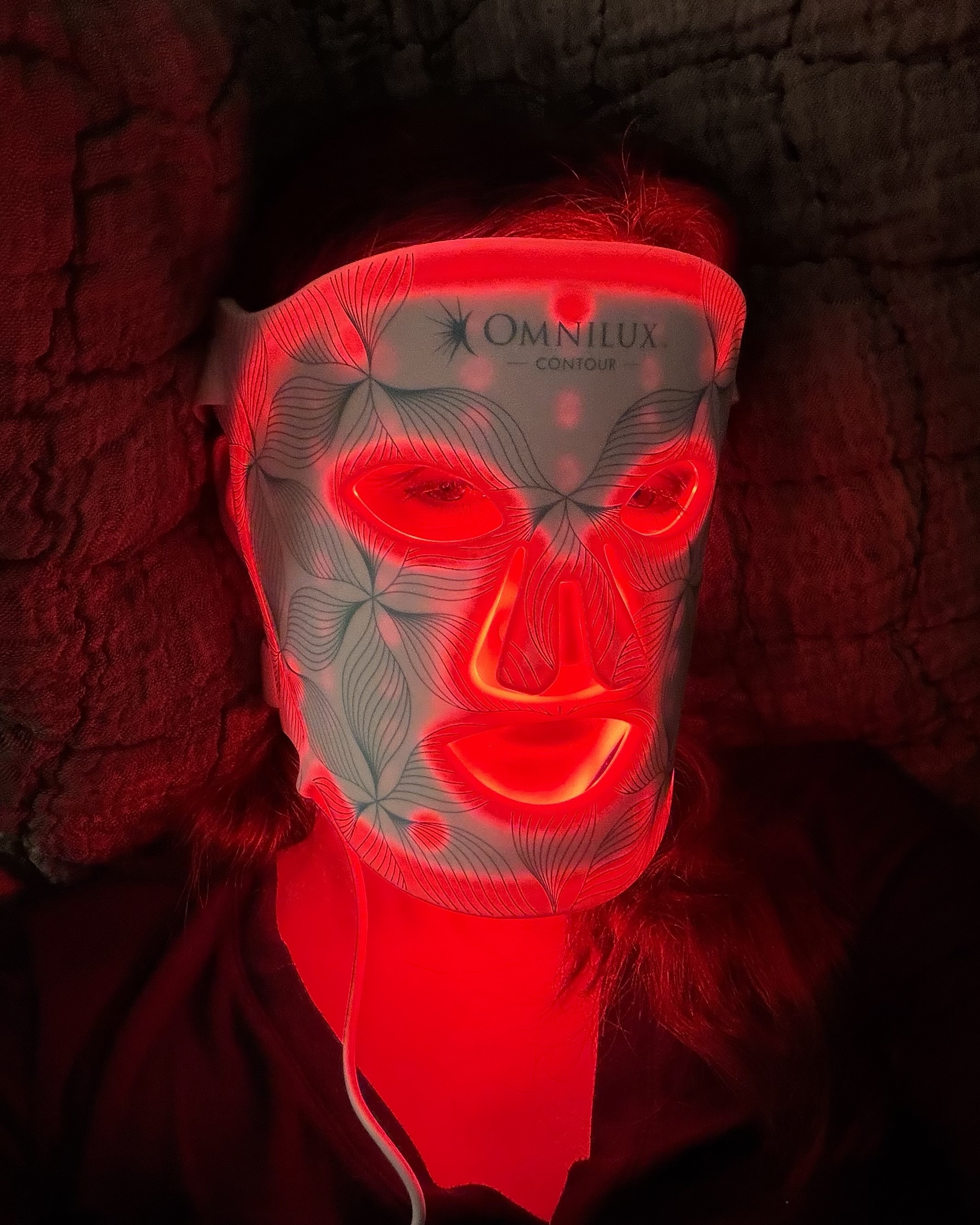 An image of Alyssa Brascia wearing the Omnilux Contour Face Mask.