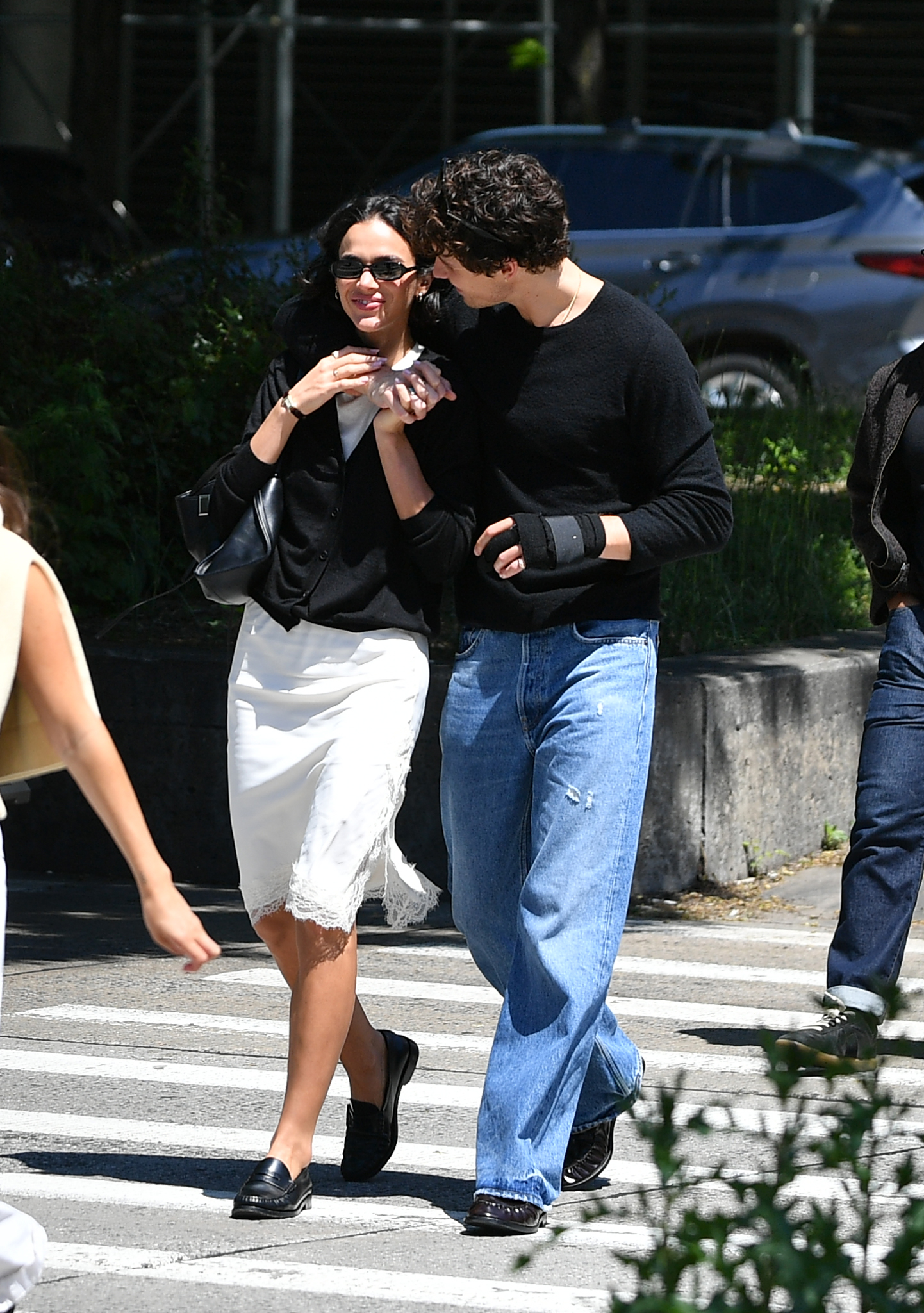 05/16/2026: Shawn Mendes and Bruna Marquezine in New York City. The Canadian singer and the Brazilian actress shared a kiss while heading to take a romantic waterfront stroll. Marquezine wore a black cardigan, white lace skirt, and black loafers