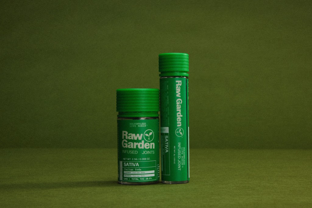 Two green Raw Garden cannabis oil cartridges on a dark green background.
