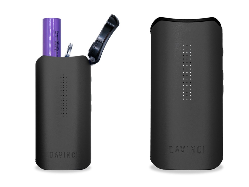 Black cylindrical device with Davinci logo and perforated design, holding a purple marker.