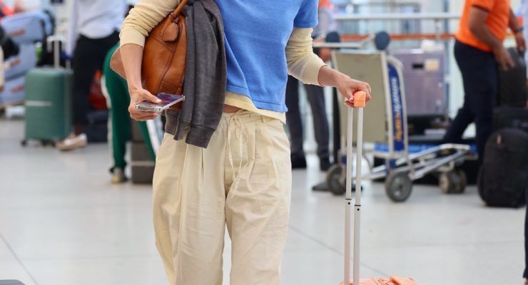 Not Sneakers: The Anti-Trend Flats It Girls at the Airport Are Wearing With Drawstring Pants