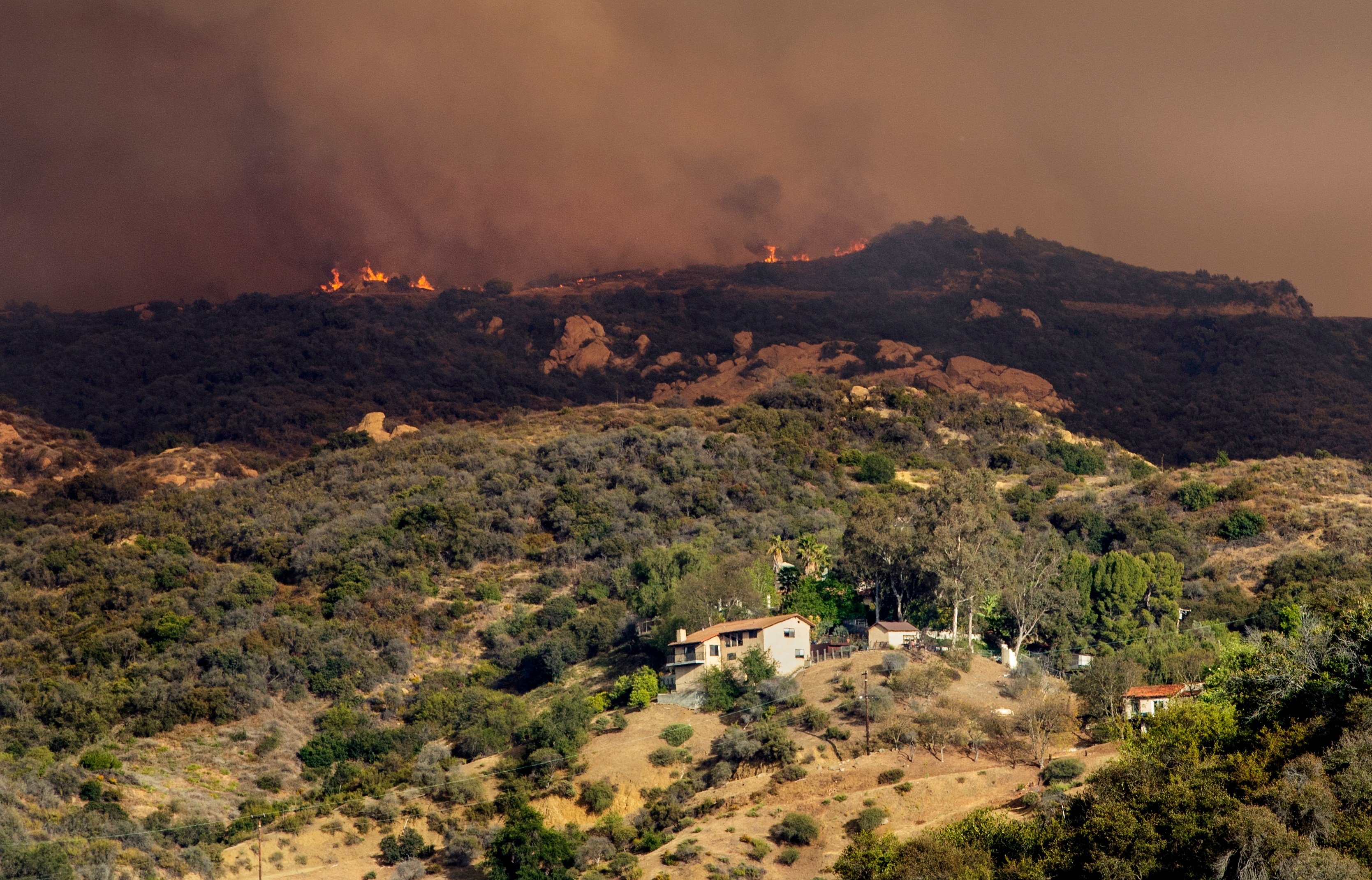 Palisades fire burns above Topanga Canyon Blvd in Los Angeles, CA.