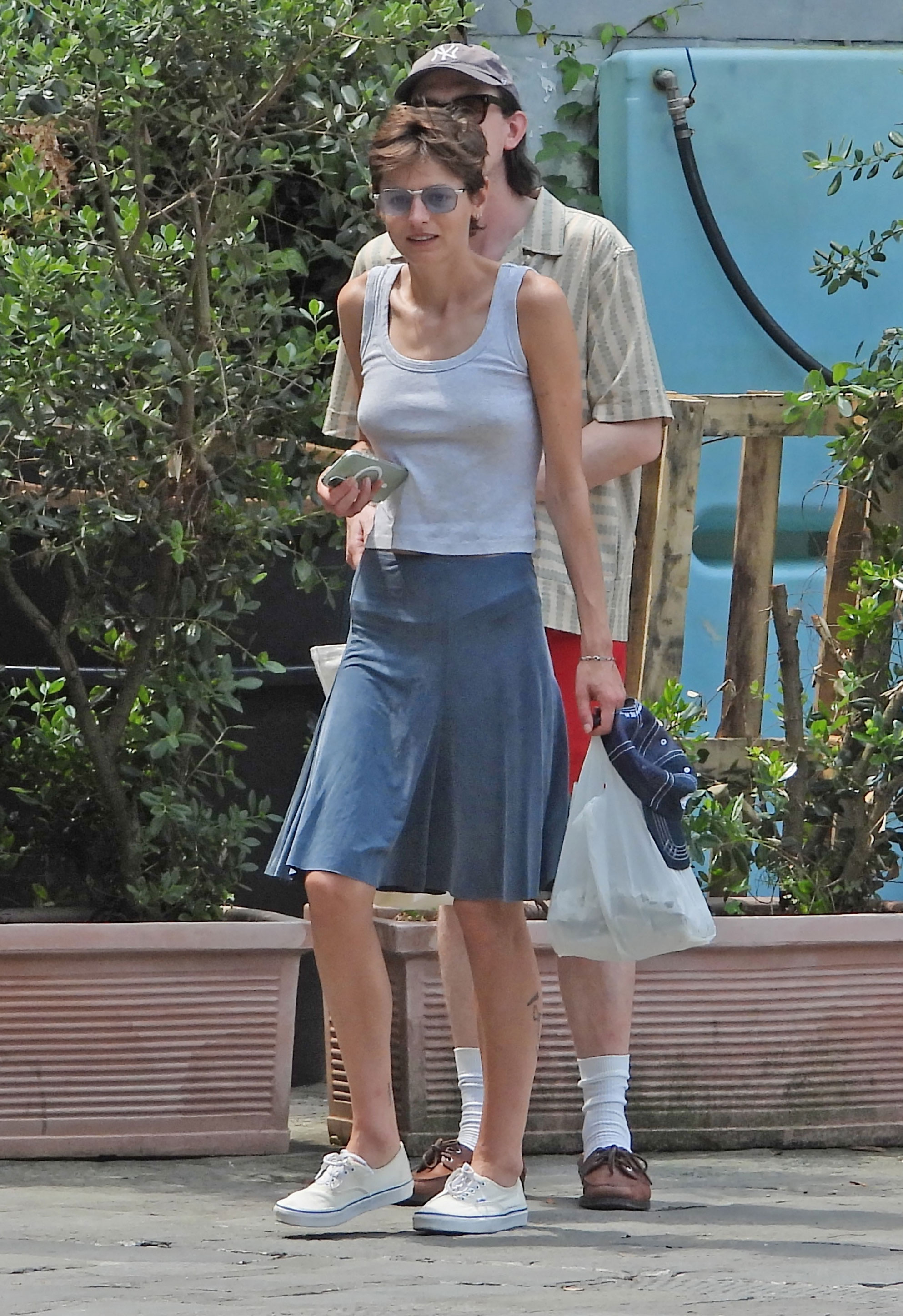 Emma Corrin wears a tank top in Portofino