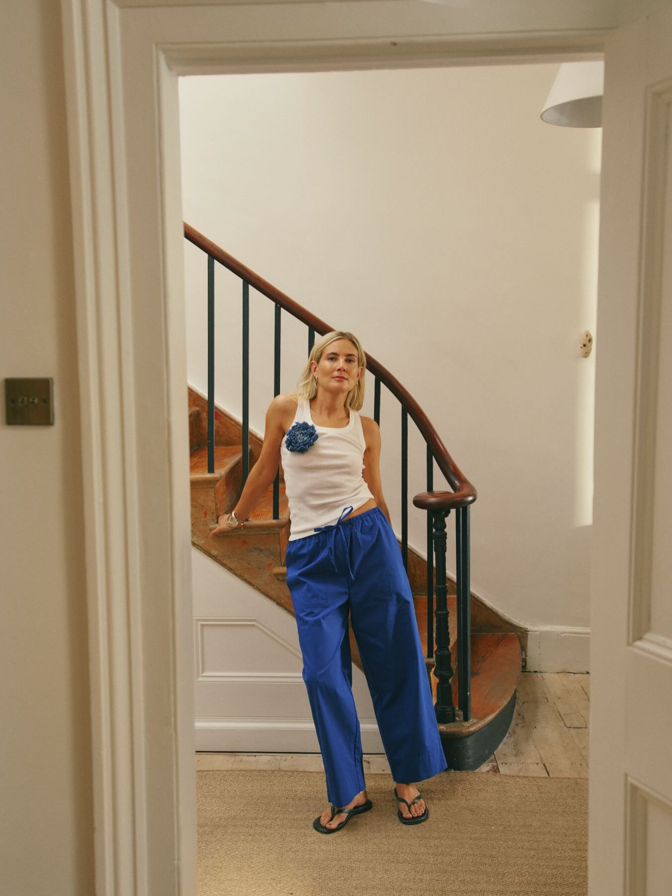 Lucy Williams wearing cobalt blue trousers