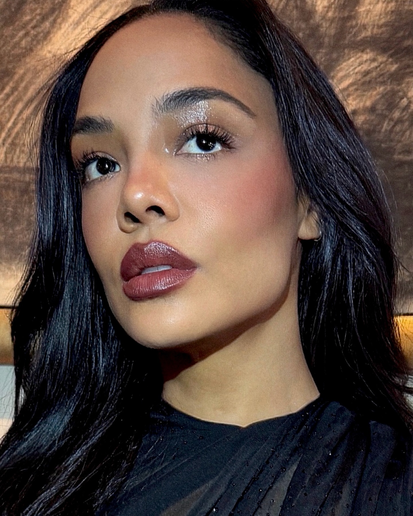 Tessa Thompson with shimmery eye makeup.