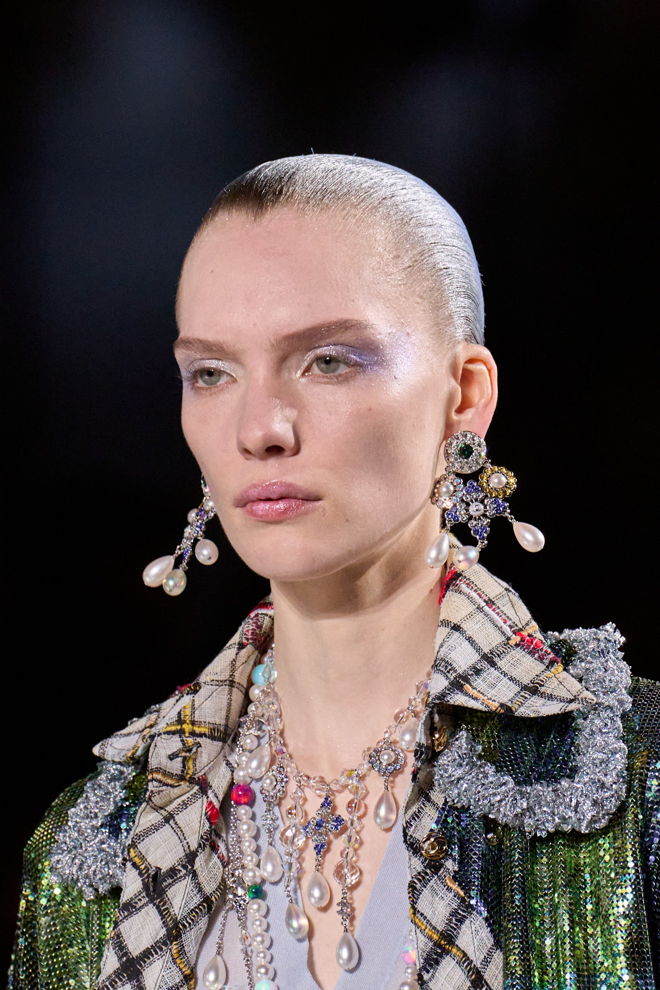 A model walking in the Chanel F/W 26 show.