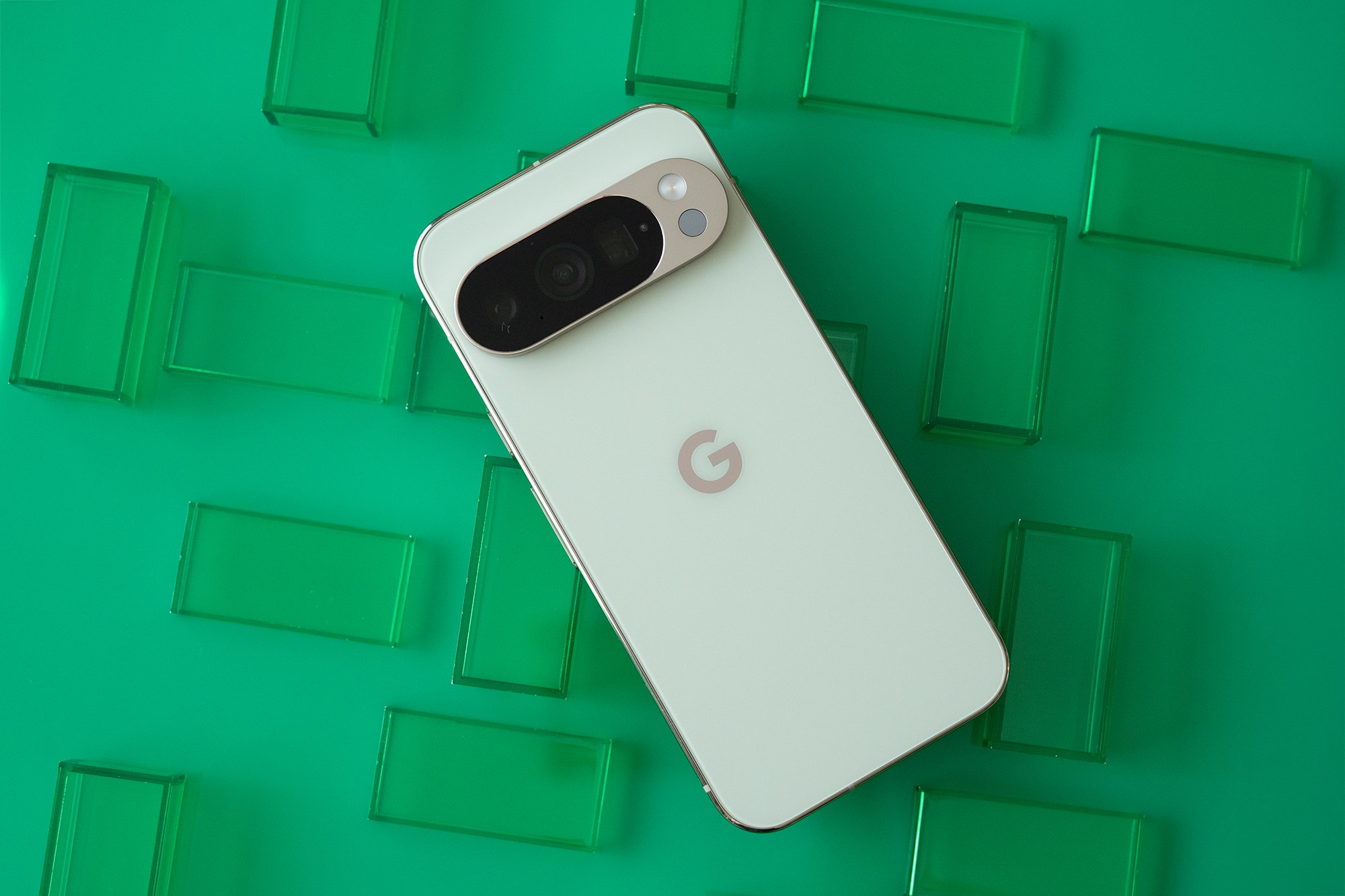 Google Pixel 10 Pro showing back panel on a grid of green rectangles