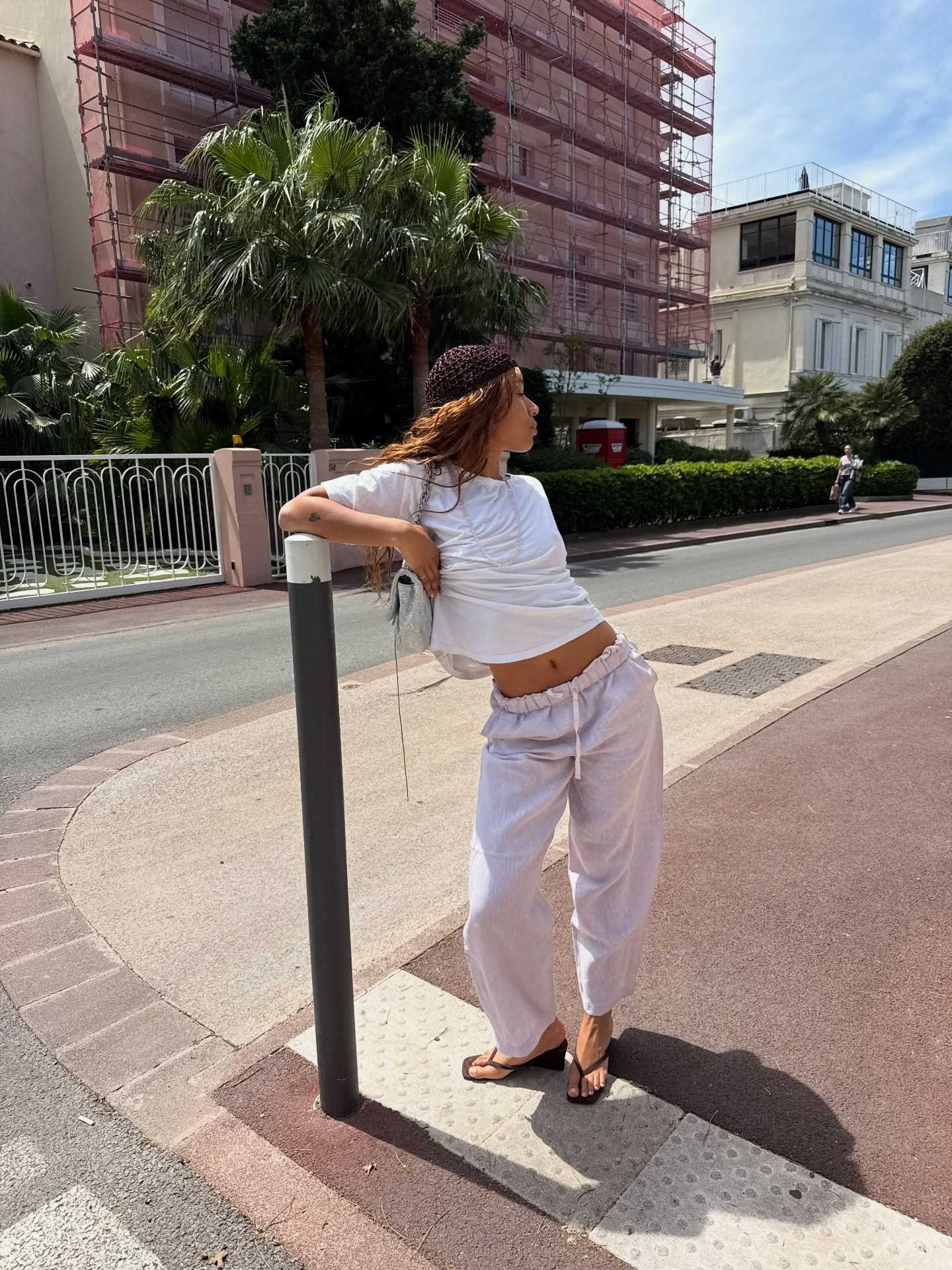 @fiahamelijnck wearing drawstring trousers and wedge sandals.