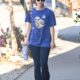 Forget Leggings—This Pants Trend Looks Even Better With Black Sneakers