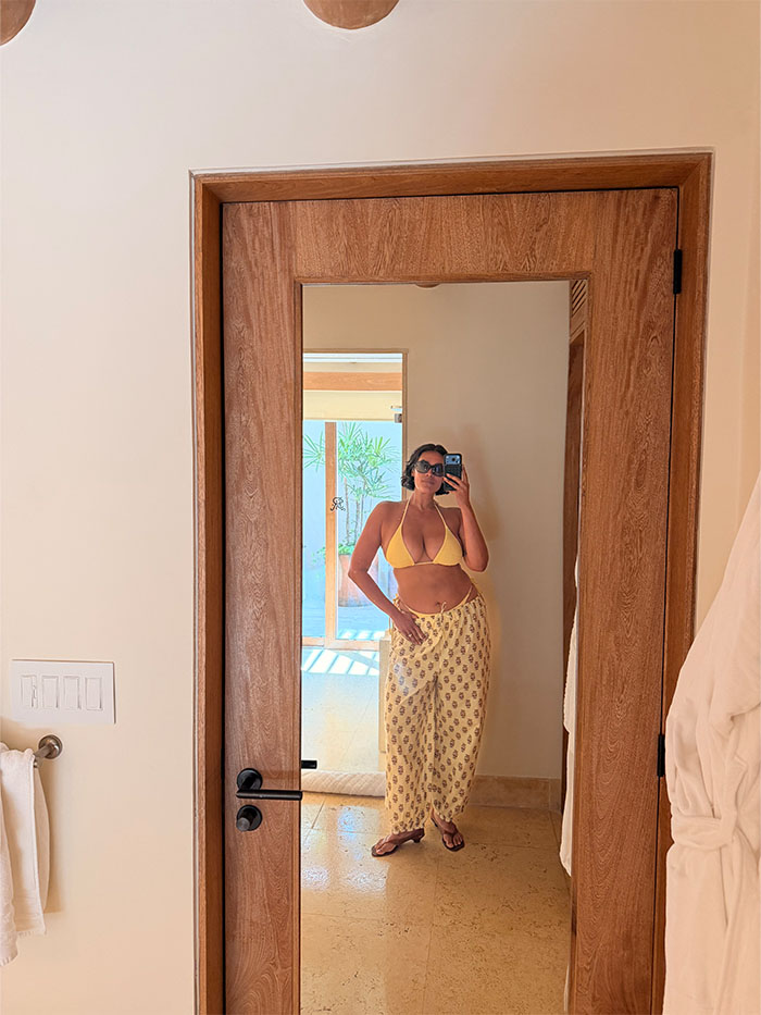 Jennifer Atilemile wearing a vacation outfit.