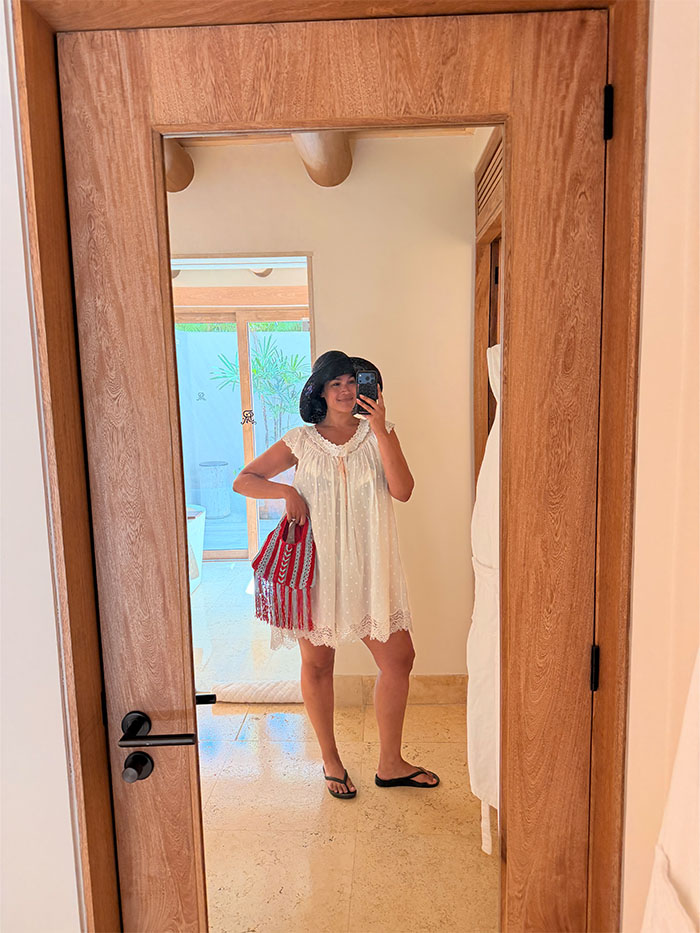 Jennifer Atilemile wearing a vacation outfit.