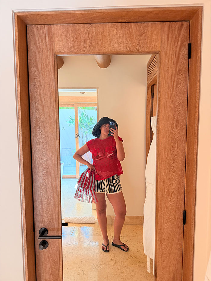 Jennifer Atilemile wearing a vacation outfit.