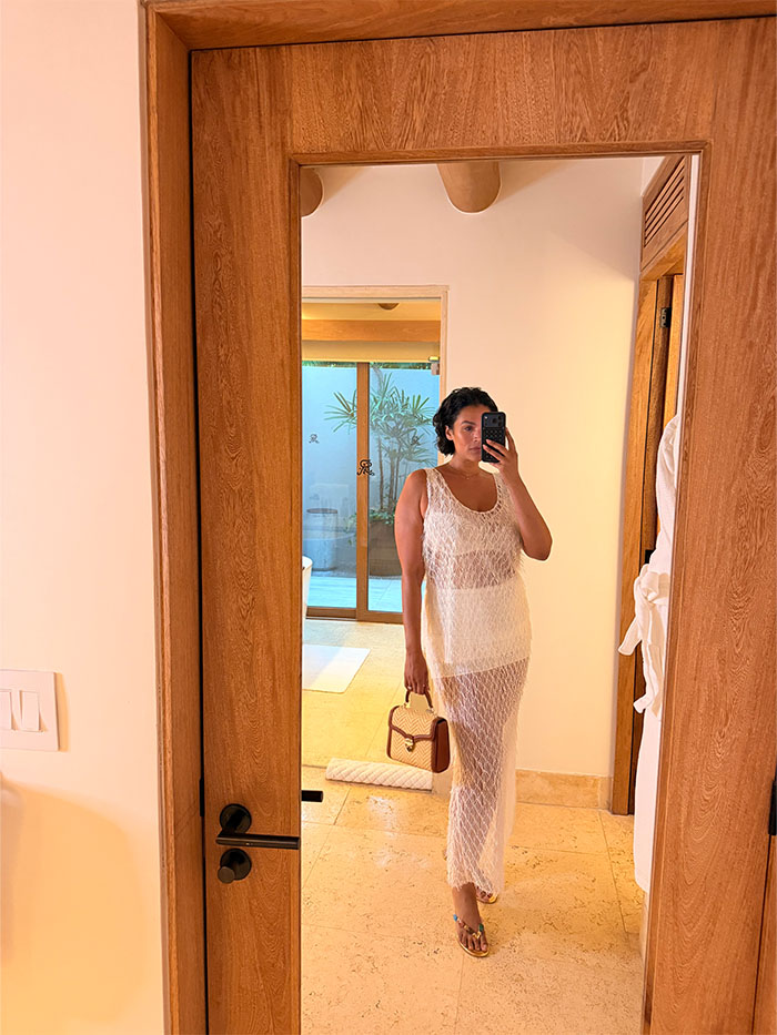Jennifer Atilemile wearing a vacation outfit.