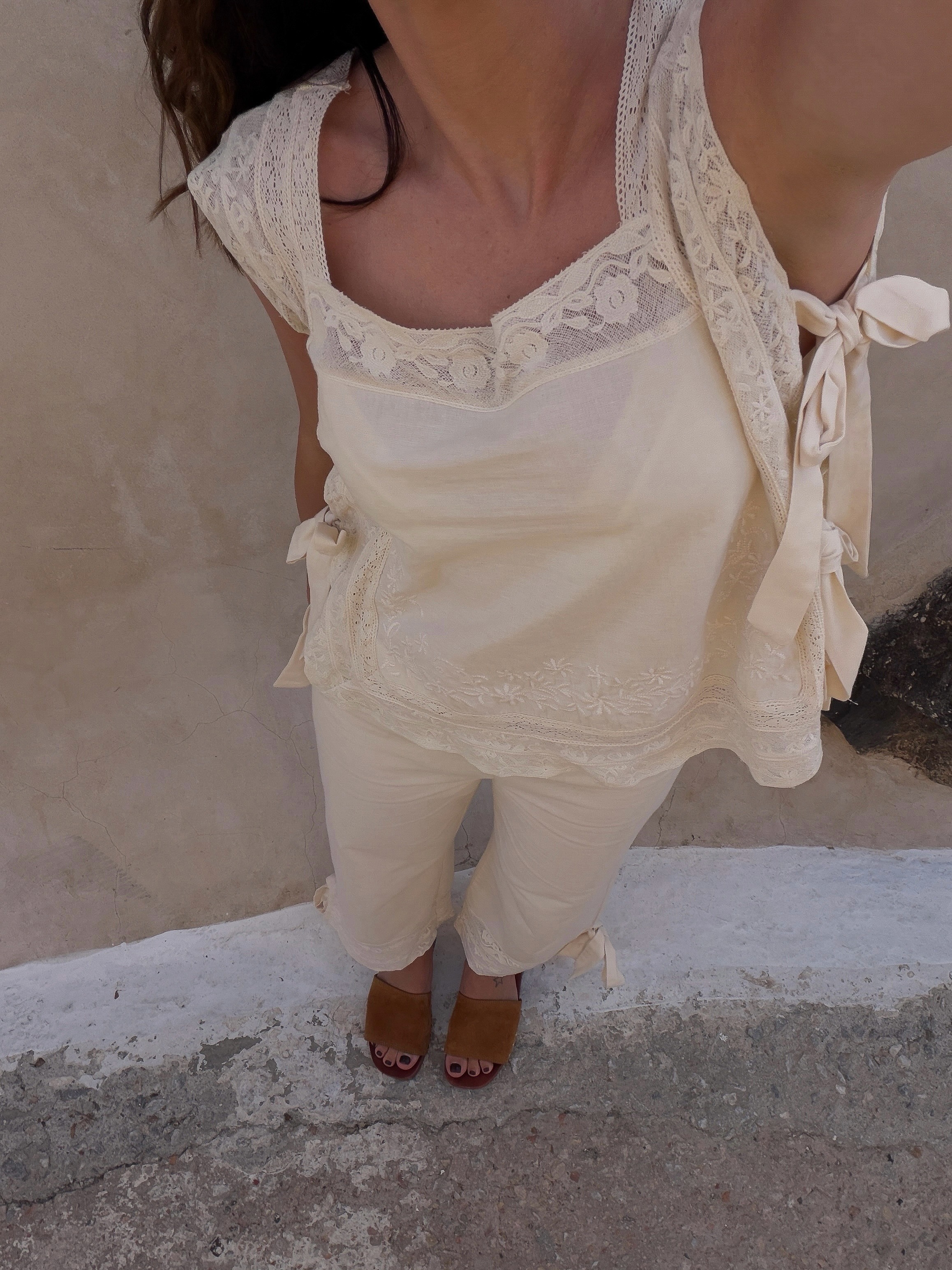 Woman wearing white blouse and trousers