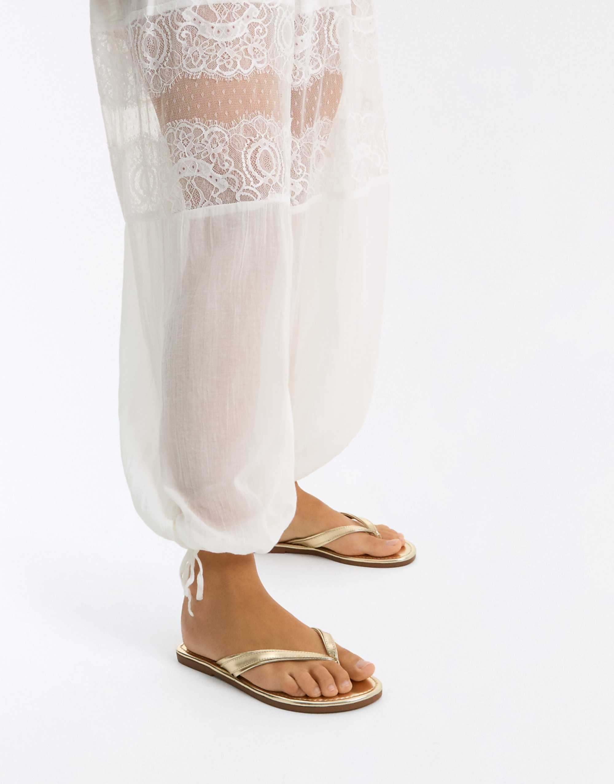 Bershka Flat Thong Sandals in Gold