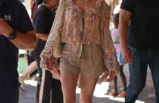 Spotted in Paris—the Surprising Shoe Trend That Looks Chic with Shorts and Knee-Length Skirts