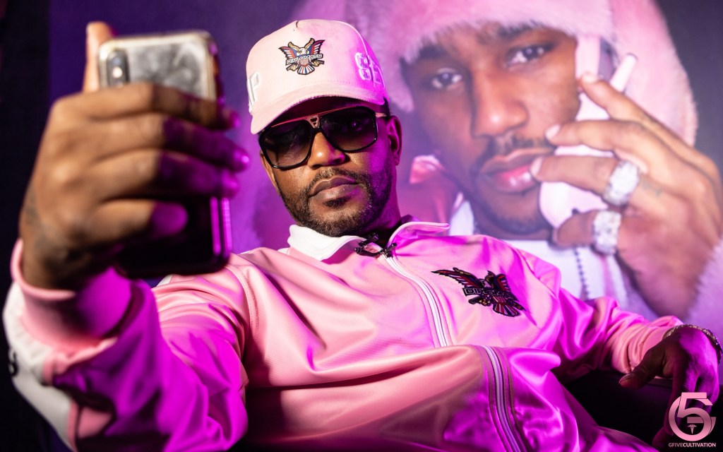 Cam'ron has some explaining to do. The photographer who took the iconic photo of him wearing a pink fur is suing him.