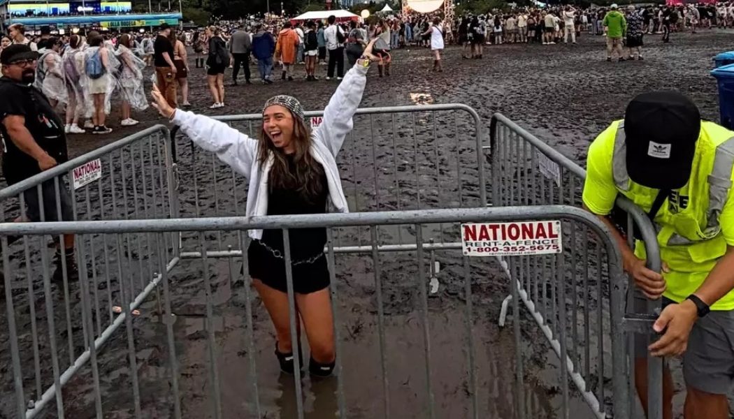 Lollapalooza Grounds Trap Woman in Knee-Deep Mud Pit