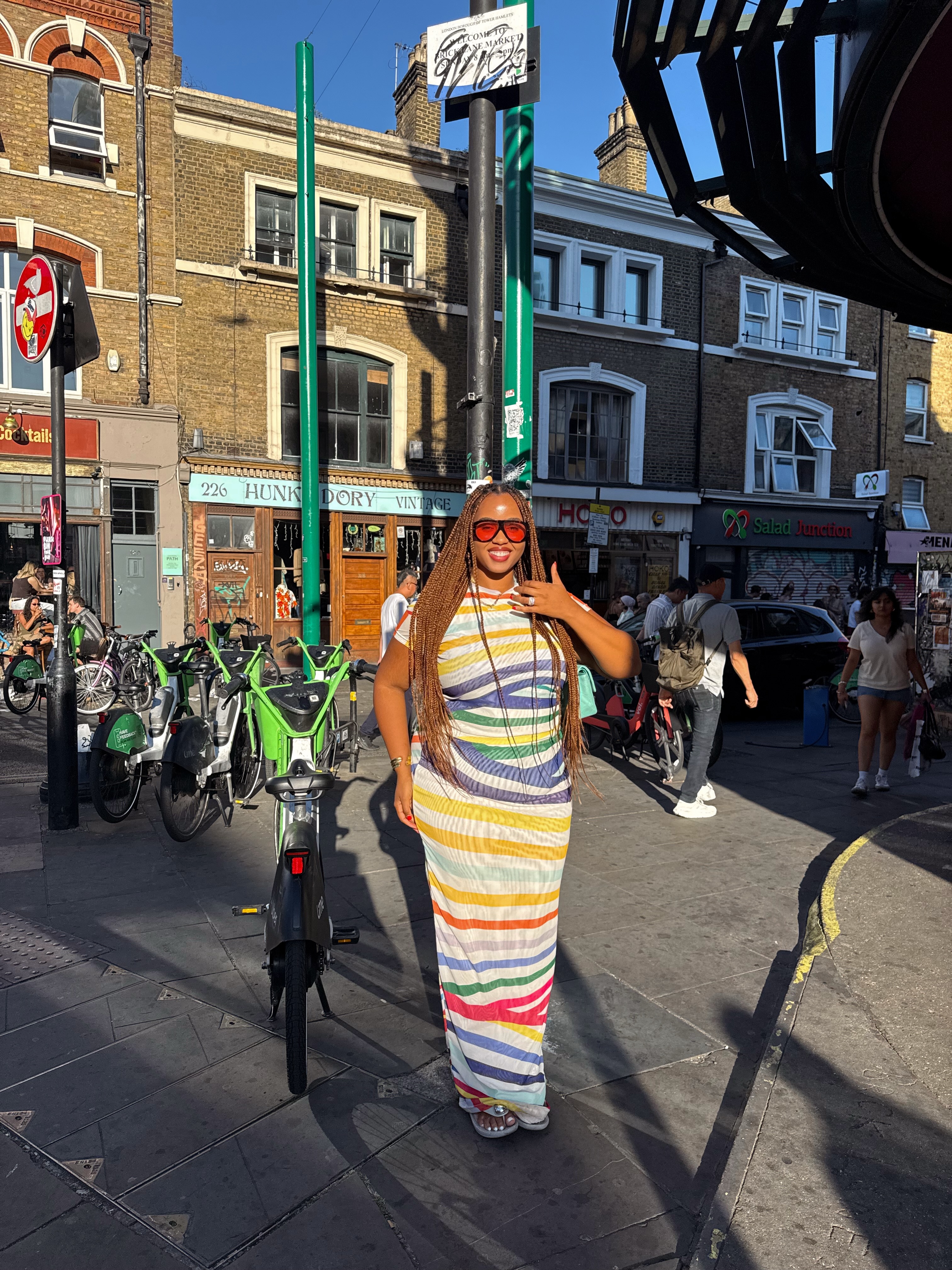 An image of a woman wearing striped dress for summer 2026